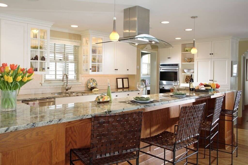 A Island Range Hood With a Kitchen Stove